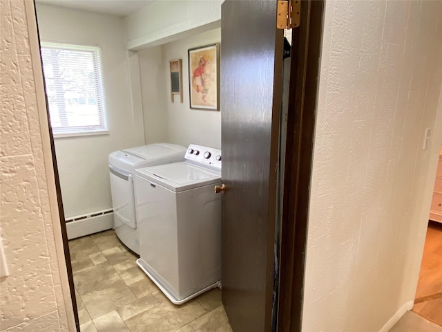 laundry area featuring a baseboard radiator, independent washer and dryer, baseboards, and laundry area