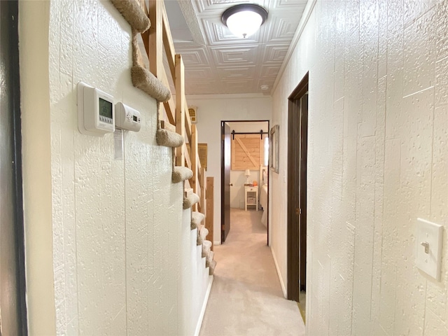 hall featuring stairway, an ornate ceiling, and light colored carpet