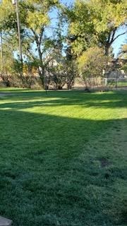 view of home's community with a lawn