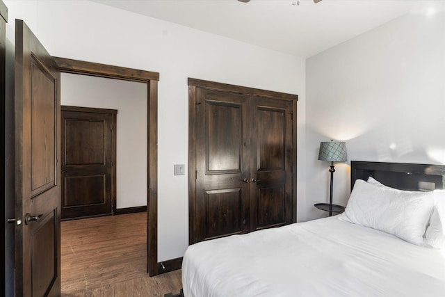 805 Broken Choker Ln, Bigfork, MT 59911 - bedroom with wood finished floors, baseboards, and a closet