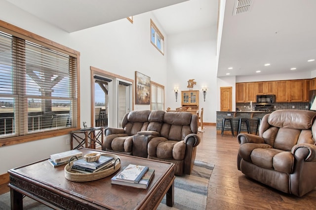 6205 Davos Ln Unit B, Whitefish, MT 59937 - living room with wood finished floors, recessed lighting, and a high ceiling