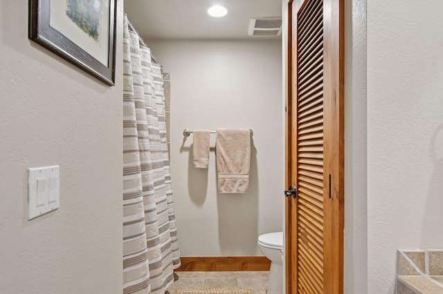 6205 Davos Ln Unit B, Whitefish, MT 59937 - bathroom with a closet, curtained shower, tile patterned floors, and recessed lighting