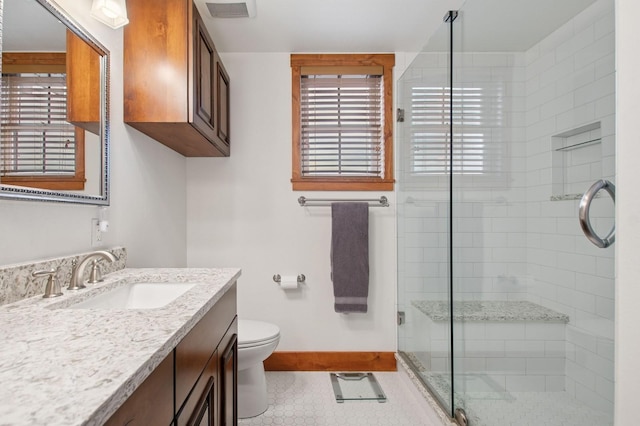 6205 Davos Ln Unit B, Whitefish, MT 59937 - full bathroom featuring vanity, a stall shower, and tile patterned floors
