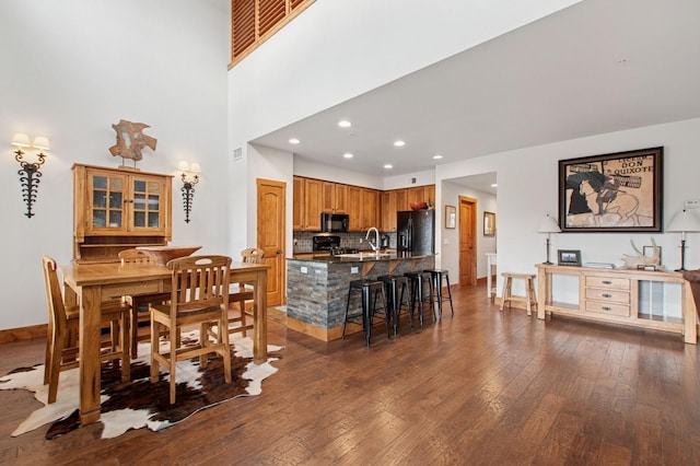 6205 Davos Ln Unit B, Whitefish, MT 59937 - dining area with dark wood-type flooring and recessed lighting