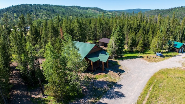 bird's eye view featuring a mountain view and a wooded view