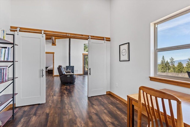 563 Riding High Dr, Eureka, MT 59917 - interior space with wood finished floors, a towering ceiling, and baseboards