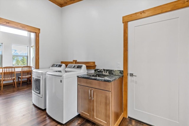 563 Riding High Dr, Eureka, MT 59917 - laundry area with washer and dryer, cabinet space, and dark wood-type flooring