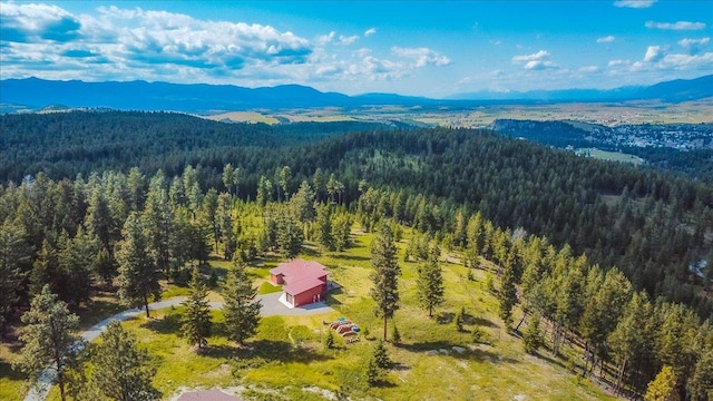 563 Riding High Dr, Eureka, MT 59917 - aerial view of a heavily wooded area and a mountainous background