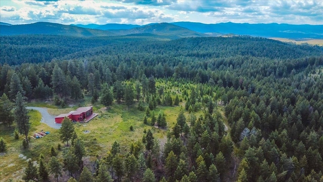 563 Riding High Dr, Eureka, MT 59917 - aerial view of a forest and a mountain backdrop