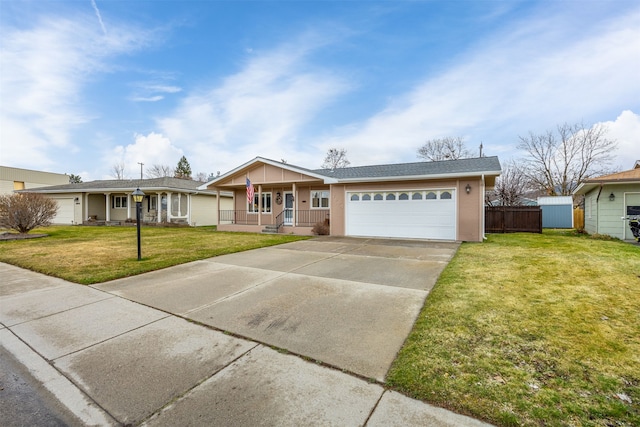 2804 Harmony Ct, Missoula, MT 59801 - ranch-style house featuring a porch, concrete driveway, and a garage