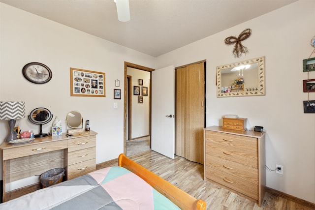 2804 Harmony Ct, Missoula, MT 59801 - bedroom with light wood finished floors, baseboards, a ceiling fan, and a closet