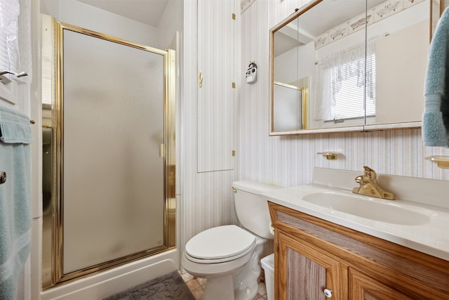 2804 Harmony Ct, Missoula, MT 59801 - bathroom featuring wallpapered walls, a stall shower, toilet, and vanity