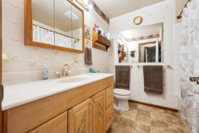 2804 Harmony Ct, Missoula, MT 59801 - full bath featuring wallpapered walls, baseboards, toilet, vanity, and a shower with curtain