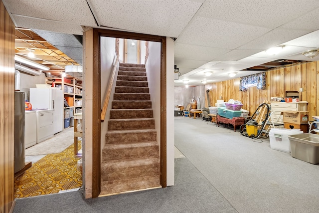 2804 Harmony Ct, Missoula, MT 59801 - finished basement with a drop ceiling, stairs, wooden walls, washer and dryer, and light colored carpet