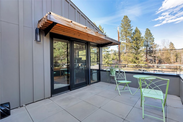 view of patio featuring a balcony