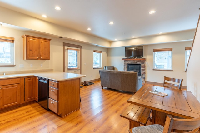 402 Sperry Ct, Whitefish, MT 59937 - kitchen with dishwasher, a peninsula, light wood-type flooring, light countertops, and recessed lighting