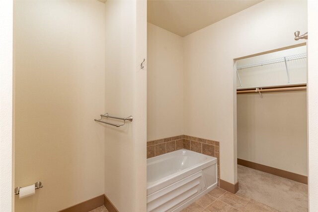 402 Sperry Ct, Whitefish, MT 59937 - bathroom featuring a bath and a walk in closet