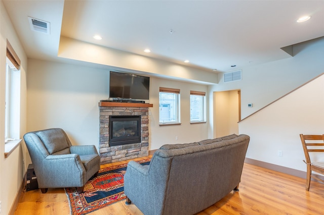 402 Sperry Ct, Whitefish, MT 59937 - living room with light wood finished floors, a fireplace, and recessed lighting