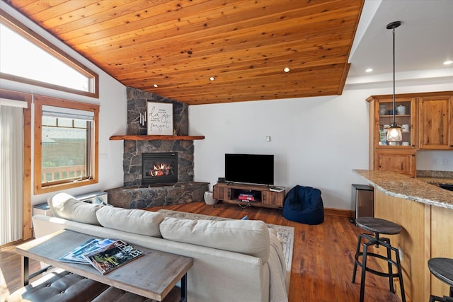 150 Adams St Unit 5, Lakeside, MT 59922 - living area with lofted ceiling, a fireplace, dark wood-style floors, recessed lighting, and wood ceiling