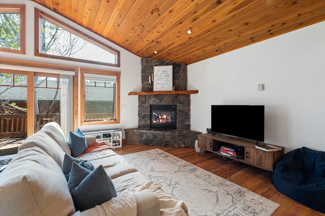living room with lofted ceiling, a wealth of natural light, and hardwood / wood-style floors