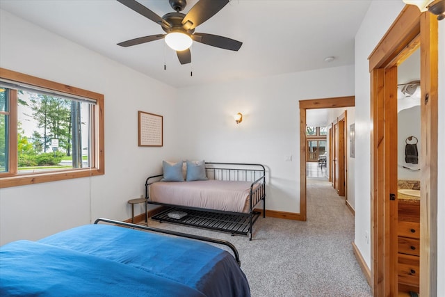 bedroom with carpet floors, a ceiling fan, and baseboards