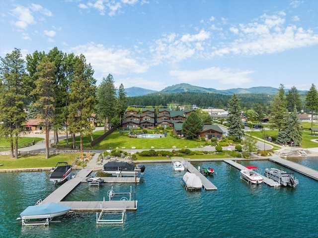 exterior space with a water and mountain view