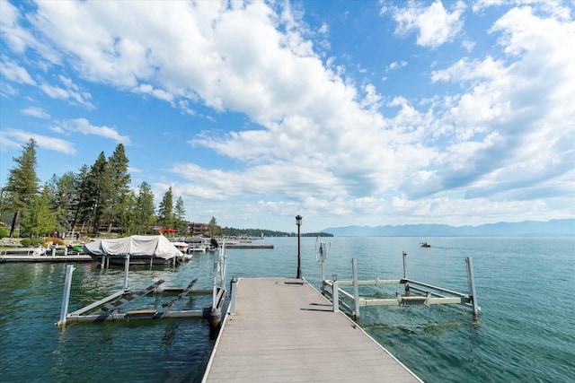 dock area with a water and mountain view