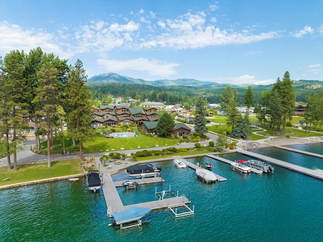 birds eye view of property with a residential view and a water and mountain view