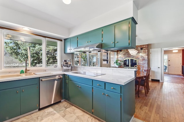 kitchen featuring light countertops, under cabinet range hood, a sink, black electric stovetop, and stainless steel dishwasher