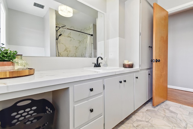 full bathroom with a shower with curtain, vanity, and visible vents