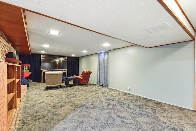 living area featuring baseboards and carpet