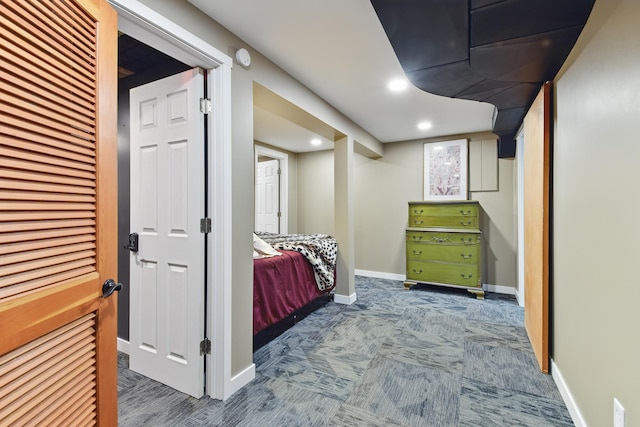 interior space featuring carpet flooring, baseboards, and recessed lighting