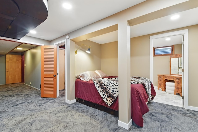 carpeted bedroom featuring baseboards and recessed lighting