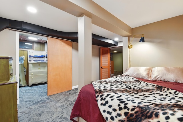 bedroom with baseboards and carpet floors