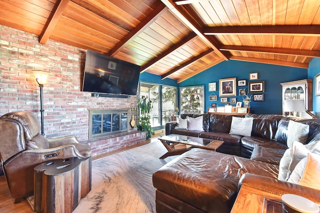 living room featuring lofted ceiling with beams, wood ceiling, a brick fireplace, and brick wall