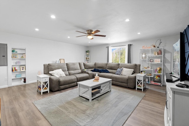 682 Latigo Ln, Bigfork, MT 59911 - living room with ceiling fan, recessed lighting, light wood-style flooring, electric panel, and built in shelves