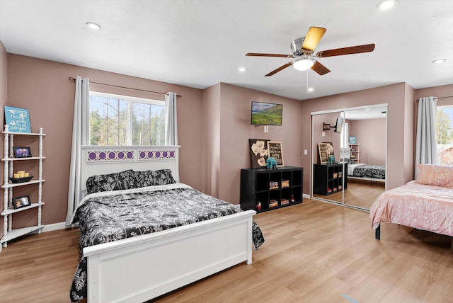 bedroom featuring recessed lighting, ceiling fan, a closet, and light wood-type flooring