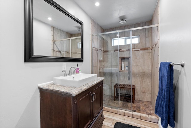 bathroom featuring vanity and a stall shower
