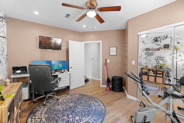 office area featuring a ceiling fan, visible vents, light wood-type flooring, baseboards, and recessed lighting