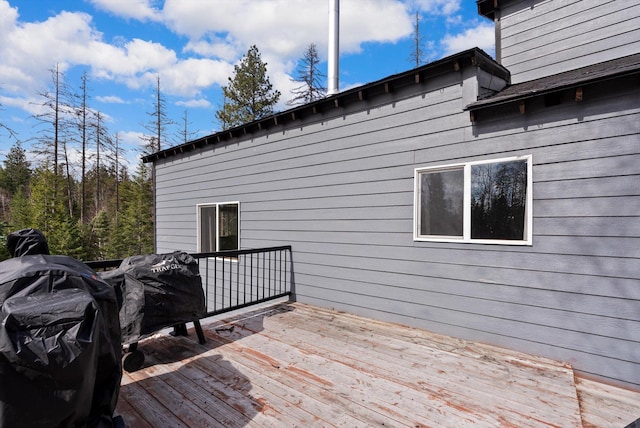 682 Latigo Ln, Bigfork, MT 59911 - wooden deck featuring grilling area