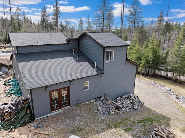 682 Latigo Ln, Bigfork, MT 59911 - rear view of house with french doors and roof with shingles