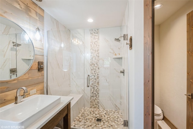 15 Haflinger Cottage Way, Eureka, MT 59917 - bathroom with a marble finish shower, recessed lighting, vanity, and toilet