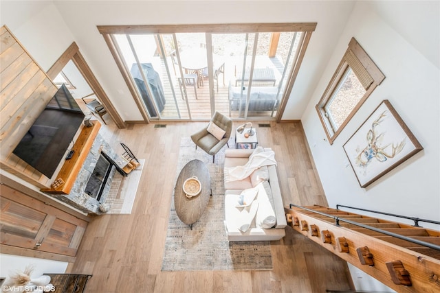 15 Haflinger Cottage Way, Eureka, MT 59917 - living room featuring wood finished floors and a fireplace