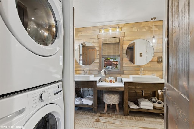15 Haflinger Cottage Way, Eureka, MT 59917 - bathroom with stacked washer / drying machine, wood walls, and double vanity