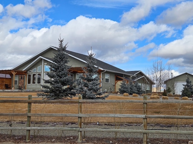 view of front facade featuring fence