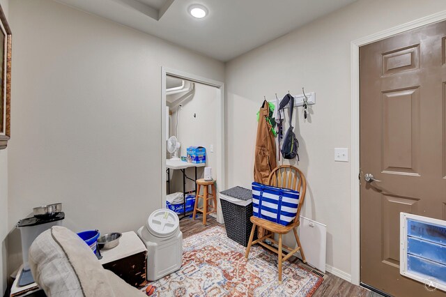 interior space with baseboards and wood finished floors