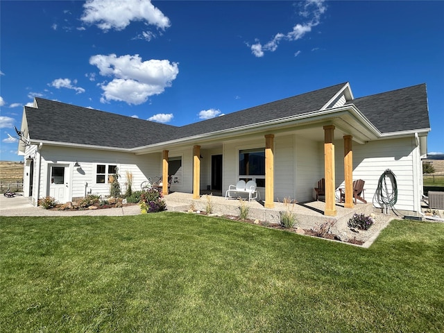 5632 Fairview Ln, Florence, MT 59833 - view of front of property with a front yard, a patio area, and roof with shingles
