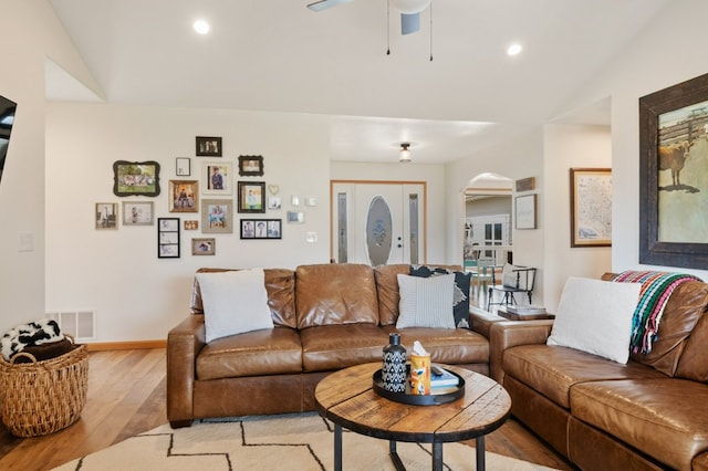 5632 Fairview Ln, Florence, MT 59833 - living area featuring light wood finished floors, lofted ceiling, arched walkways, ceiling fan, and recessed lighting