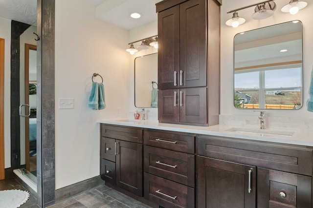 5632 Fairview Ln, Florence, MT 59833 - full bath with double vanity, a sink, baseboards, and a shower stall