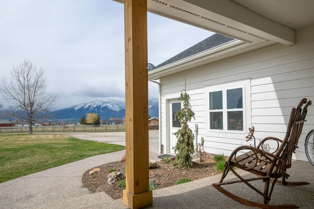 5632 Fairview Ln, Florence, MT 59833 - view of patio with a mountain view and fence